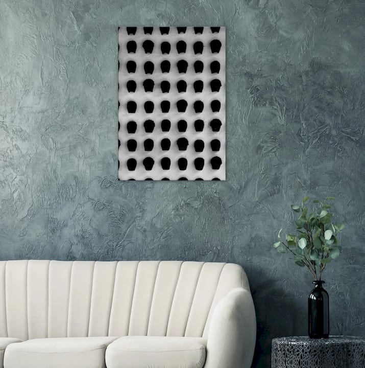 Designer styling black and white prints on living room wall