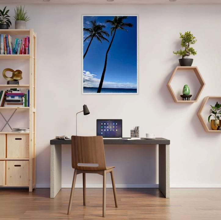 Woman adjusting wall art in modern living room