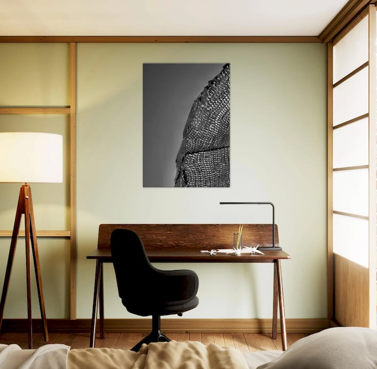 Woman hanging art gift in modern living room