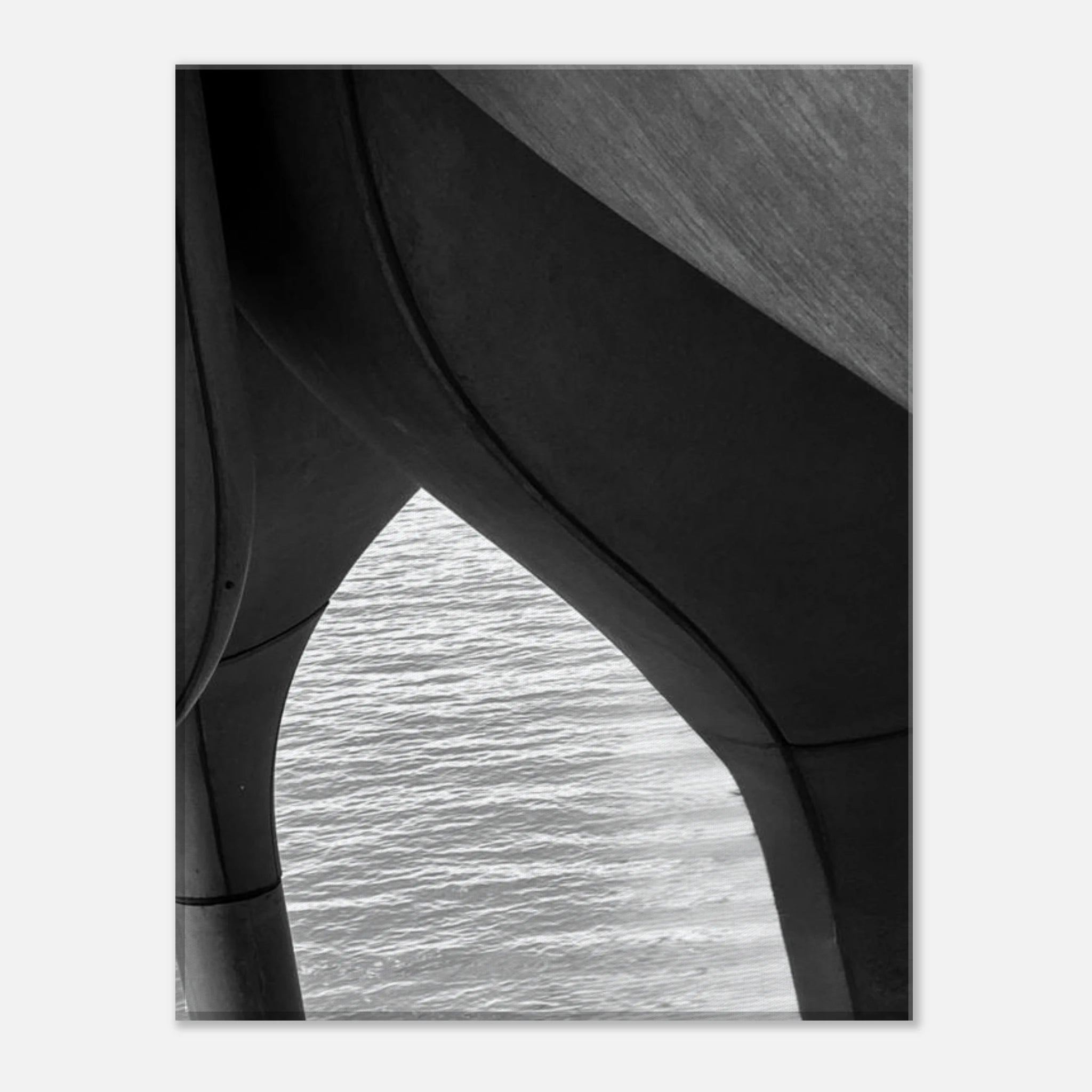 Black and white abstract canvas print of NYC Hudson River pier with high heels in water, part of the Studio Edition Travel Collection.