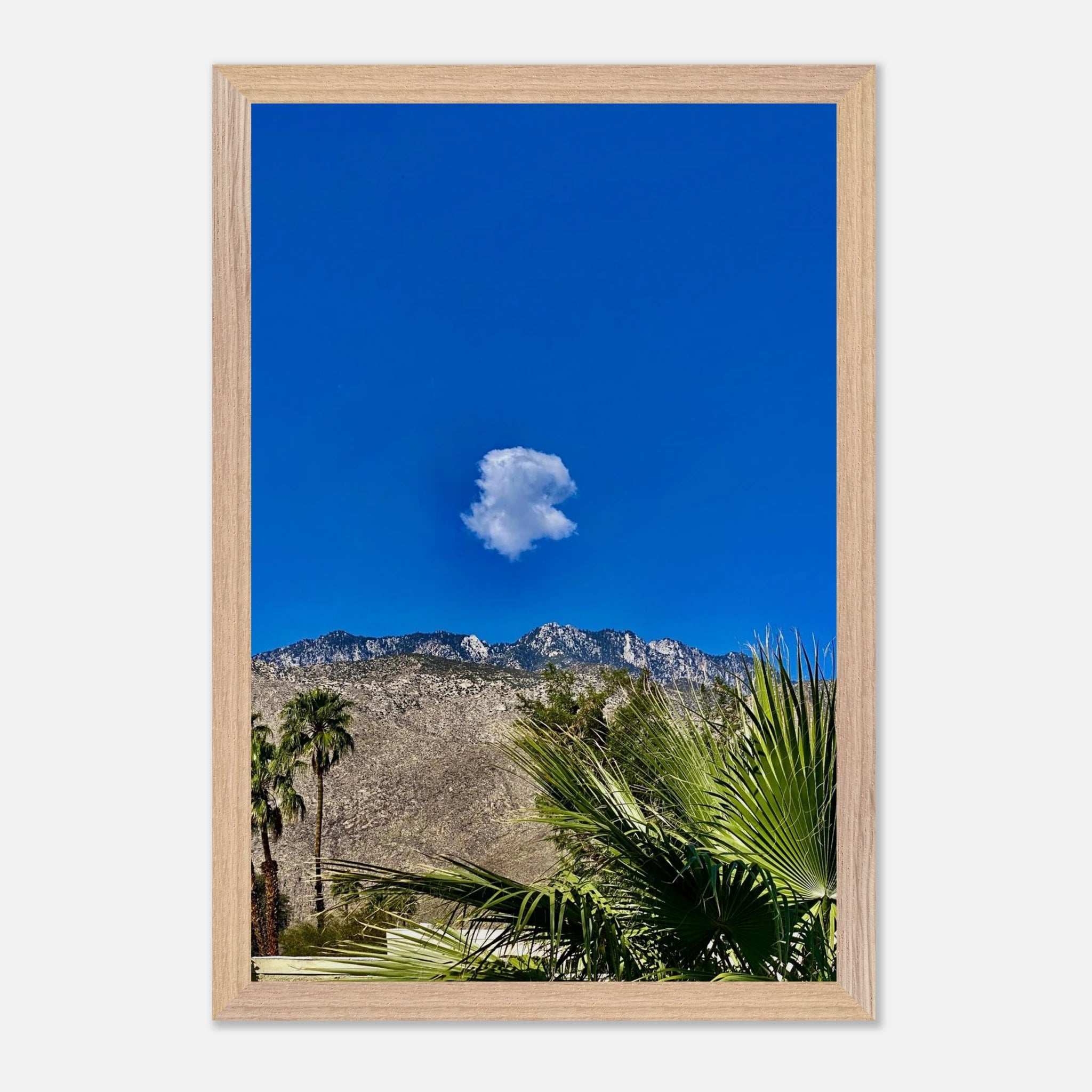 Palm Springs Cloud Mounted Wooden Framed Poster showcasing vibrant California landscape art in a stylish home decor setting.