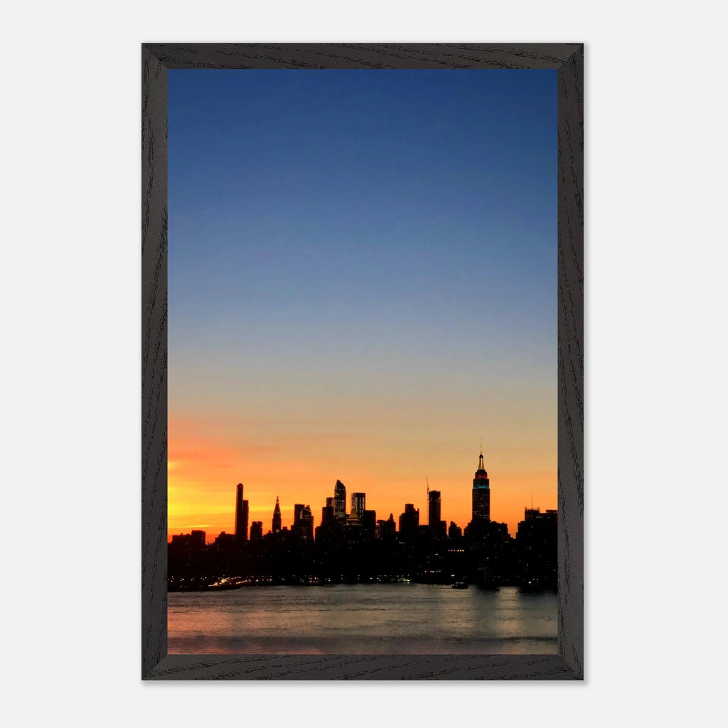 Manhattan Skyline sunset framed poster, NYC wall art print on high-quality material, showcasing iconic cityscape at dusk.