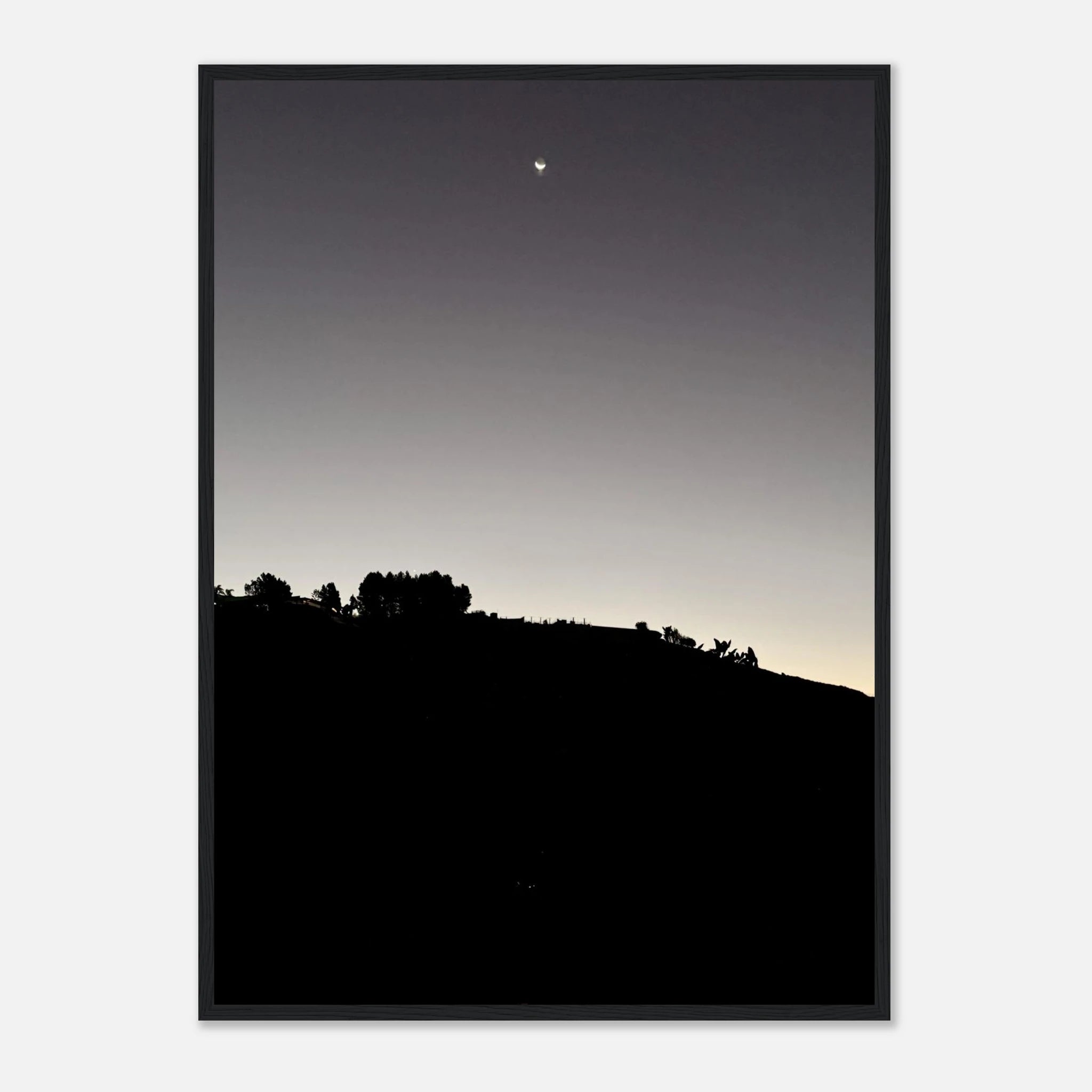 Black and white semi-glossy poster print featuring a fall moon over Hollywood Hills in California, with a wooden frame and studio edition style.
