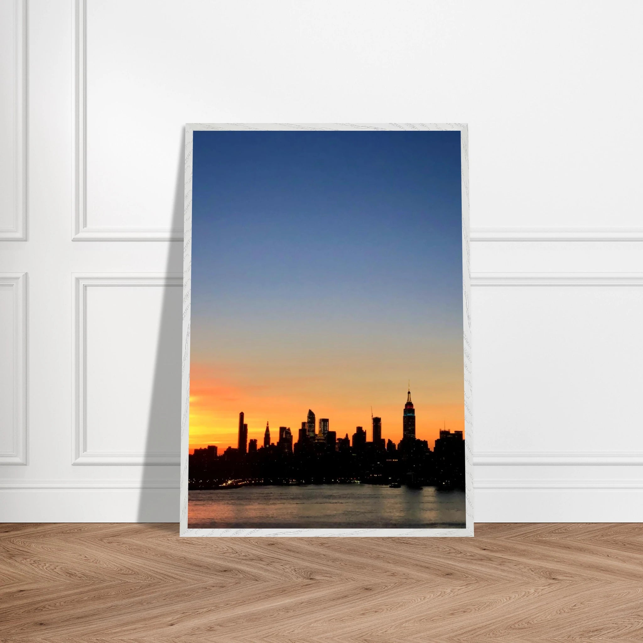 Premium wooden framed print of the Manhattan skyline at sunset, featuring vibrant colors and detailed cityscape artwork.
