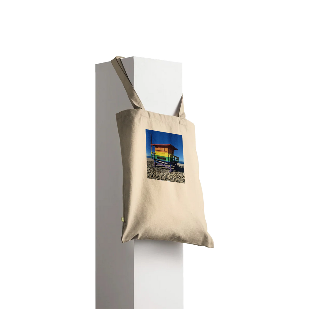 Eco-friendly Pride 2025 tote bag with colorful print supporting GLAAD, made from sustainable materials, perfect for summer outings.