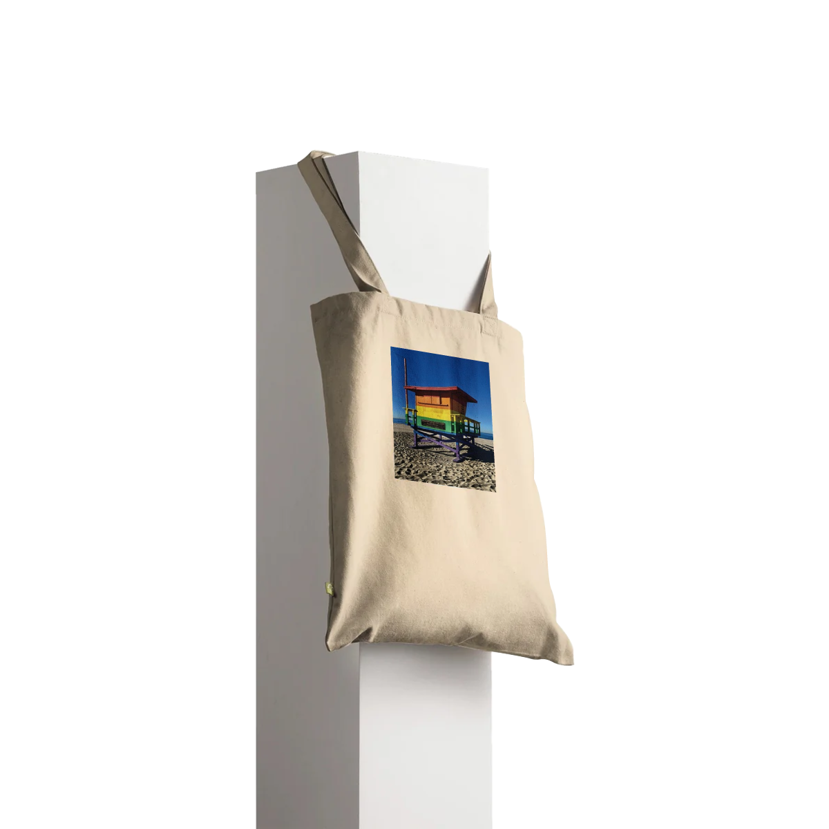 Eco-friendly Pride 2025 tote bag with colorful print supporting GLAAD, made from sustainable materials, perfect for summer use.