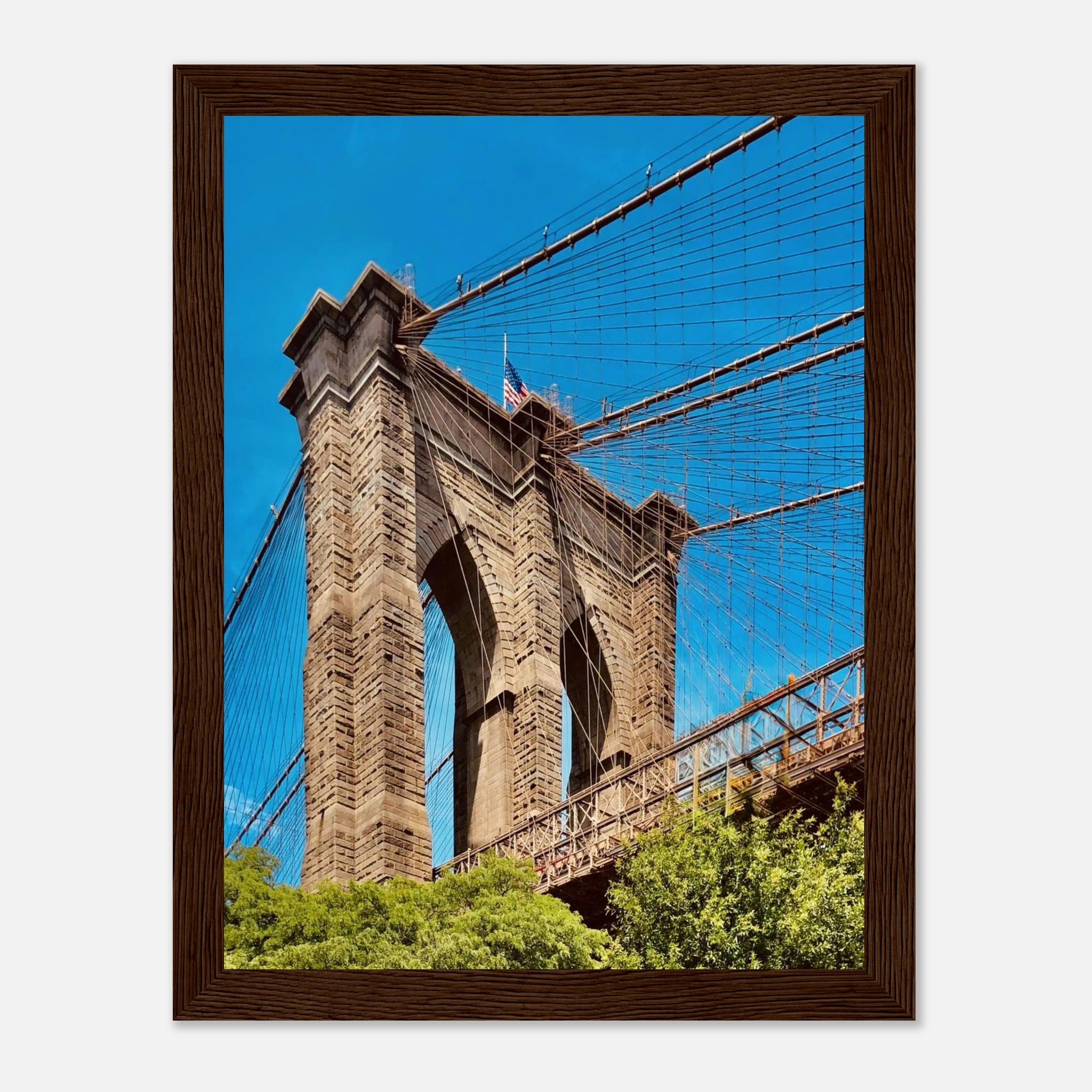 Framed NYC Brooklyn Bridge poster featuring a Dumbo view, showcasing the iconic bridge and city skyline in vibrant print material.