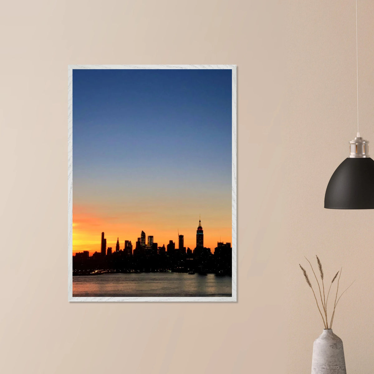 Framed Manhattan skyline sunset poster with NYC wall art print, showcasing vibrant cityscape colors and modern decor style.