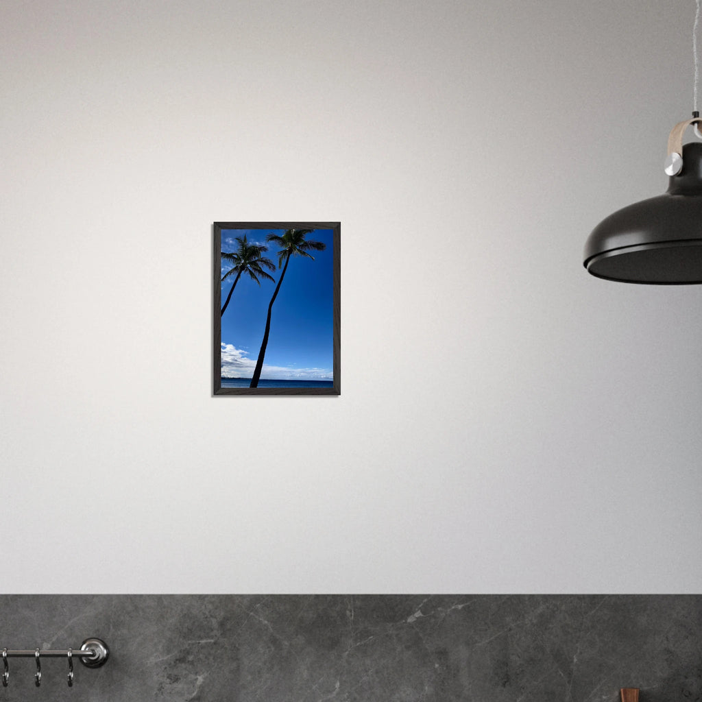 Framed print of Hawaii iconic palm tree twins and Pacific waves, travel collection studio edition by CaliCuration, mounted on wall.