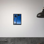 Framed print of Hawaii iconic palm tree twins and Pacific waves, travel collection studio edition by CaliCuration, mounted on wall.