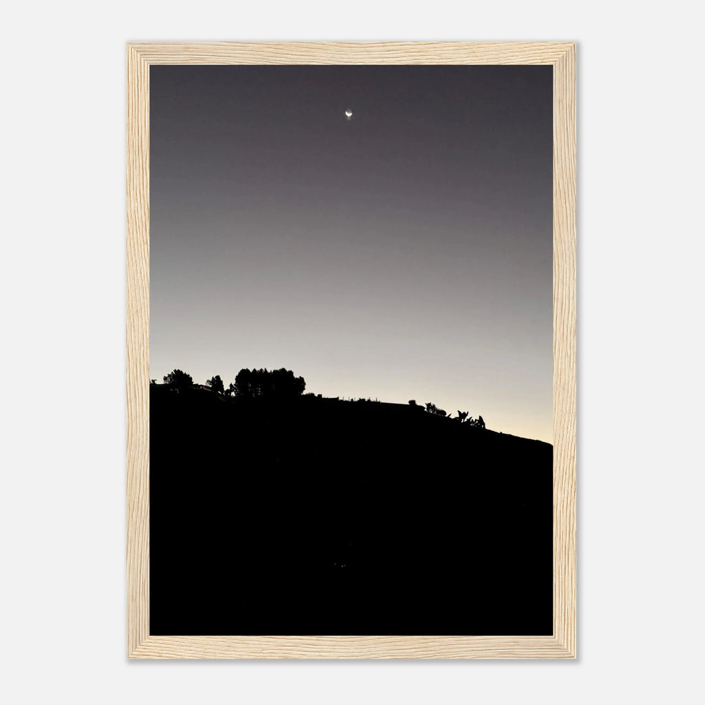 Black and white wooden framed poster featuring a fall moon over Hollywood Hills, part of the California Studio Edition art print series.