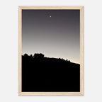 Black and white wooden framed poster featuring a fall moon over Hollywood Hills, part of the California Studio Edition art print series.