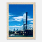 Framed NYC Manhattan Bridge and East River urban photography print, showcasing iconic New York City skyline and bridge details.