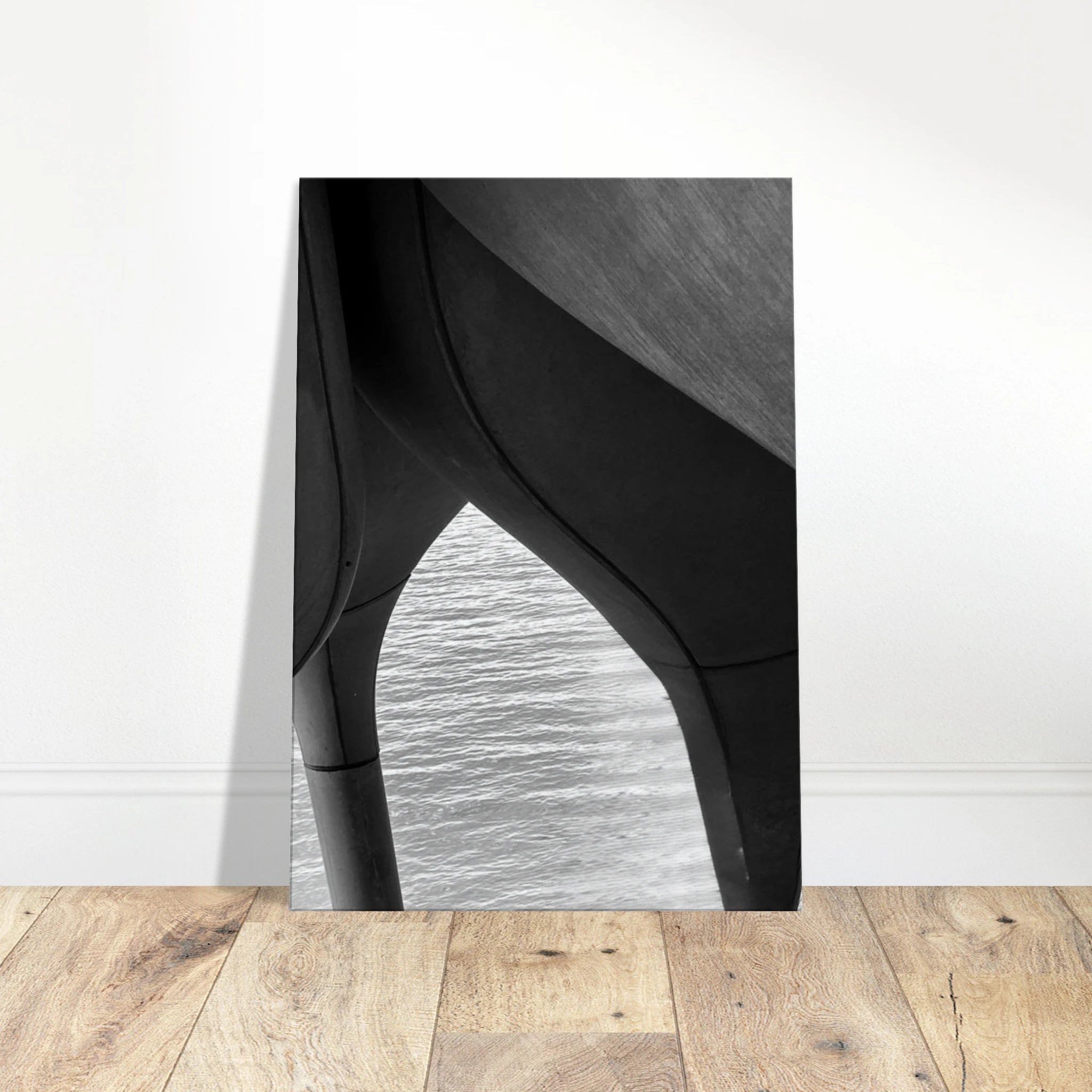 Black and white abstract canvas art print of NYC Hudson River pier with high heels in water, part of Studio Edition Travel Collection.