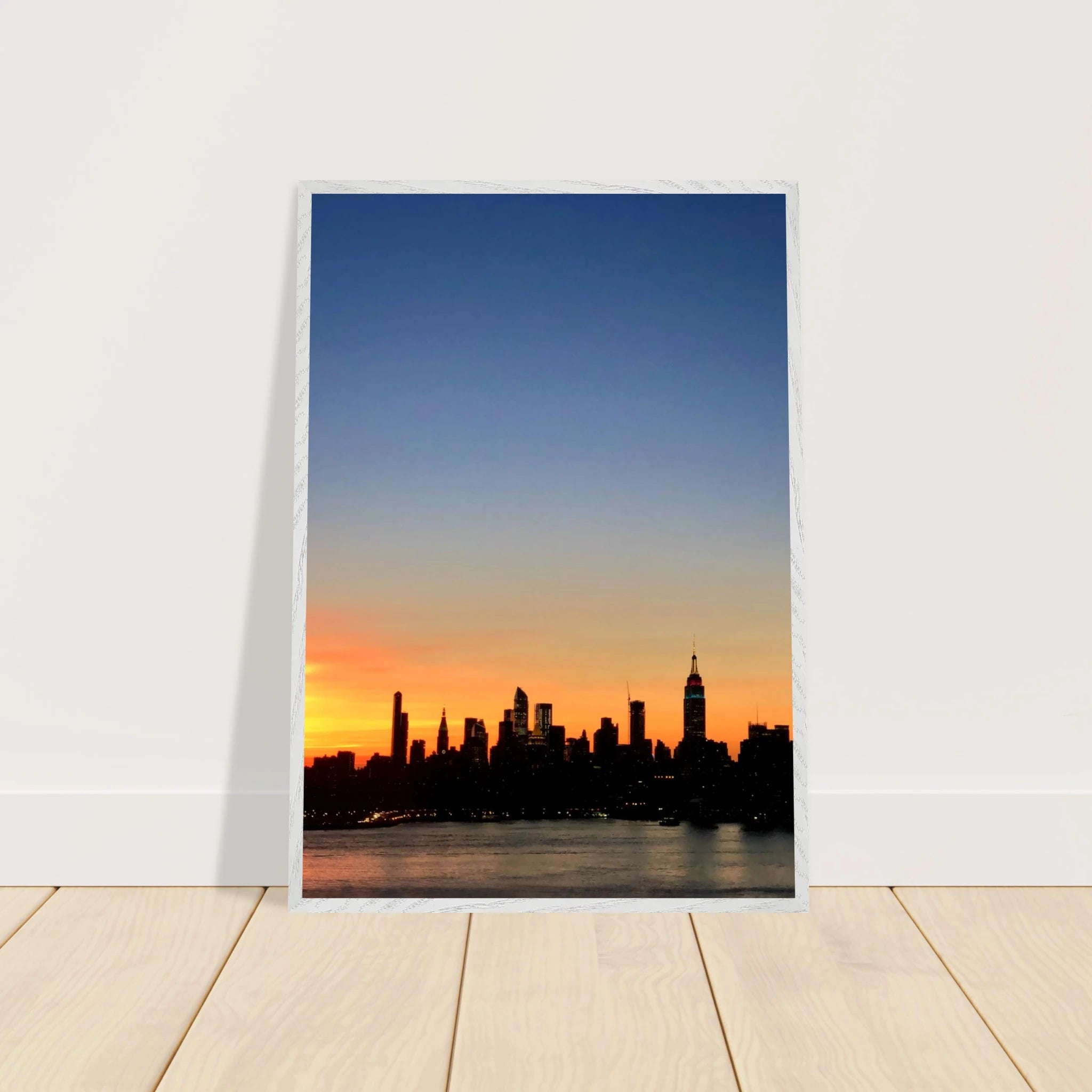 Wooden framed Manhattan skyline sunset poster from the Travel Collection, featuring vibrant cityscape wall art for home décor.