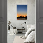 Manhattan Skyline Sunset framed poster featuring New York City wall art in print material, showcasing a vibrant cityscape at dusk.