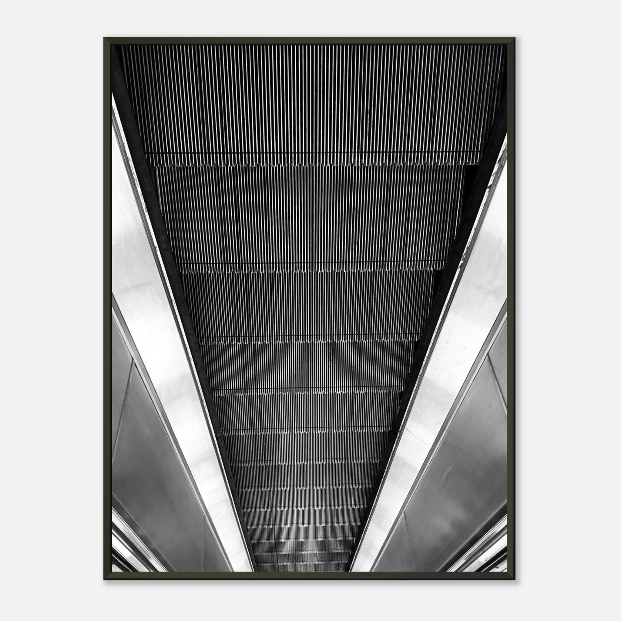 Black and white framed print of a London Tube escalator abstract from the Travel Collection Studio Edition, showcasing architectural details.
