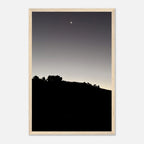 Black and white wooden framed poster of the Fall New Moon over Hollywood Hills, California art print in semi-glossy finish.