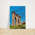 Framed NYC Brooklyn Bridge poster featuring a Dumbo view, showcasing a vibrant summer travel scene with detailed print material.