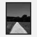 Black and white framed poster of a summer road scene from the Travel Collection, showcasing timeless travel-inspired art.