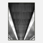 Black and white framed poster of London's tube escalator, part of the Studio Edition travel collection, displayed as a print.