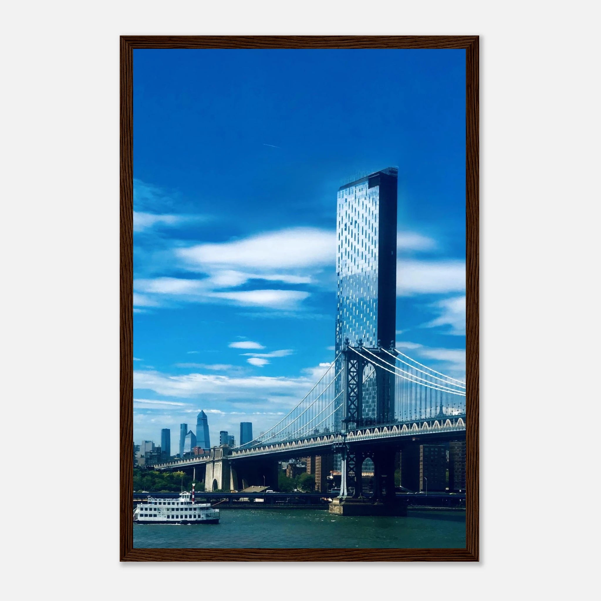 Framed urban photography print of NYC Manhattan Bridge and East River, showcasing iconic New York City skyline and bridge details.