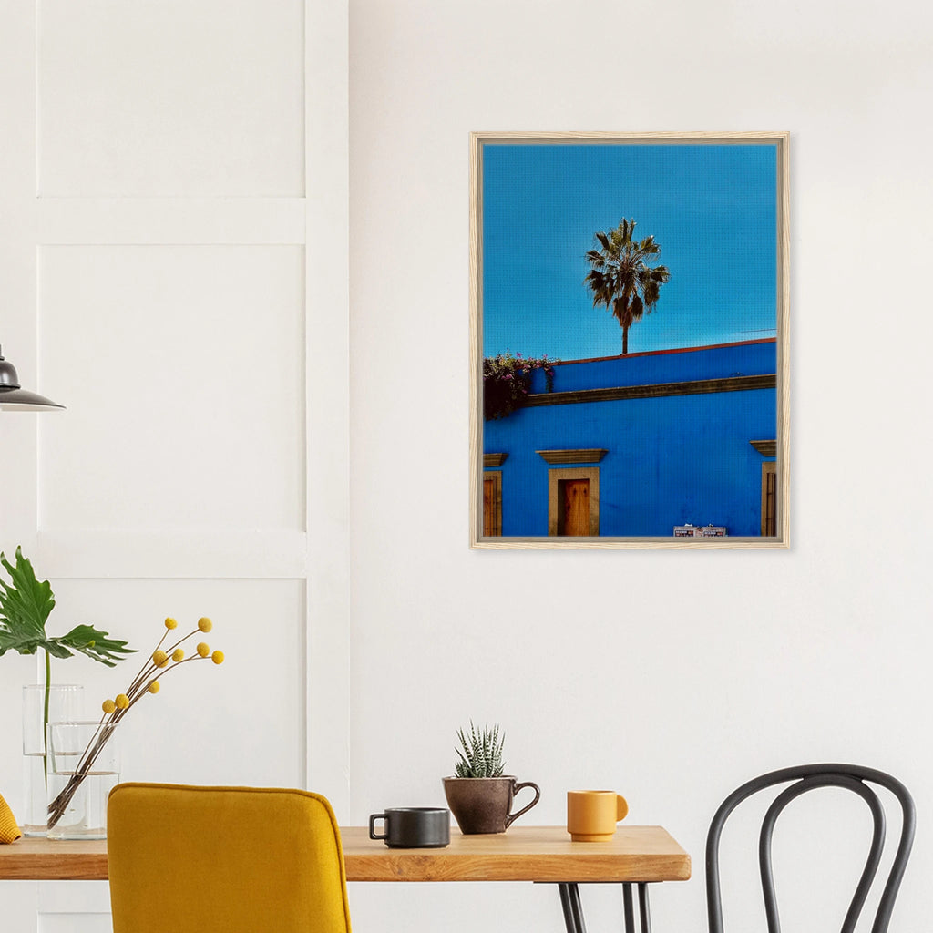 Mexico Oaxaca streets canvas print by CaliCuration featuring palm trees and vibrant city scenes in a blue frame artwork.