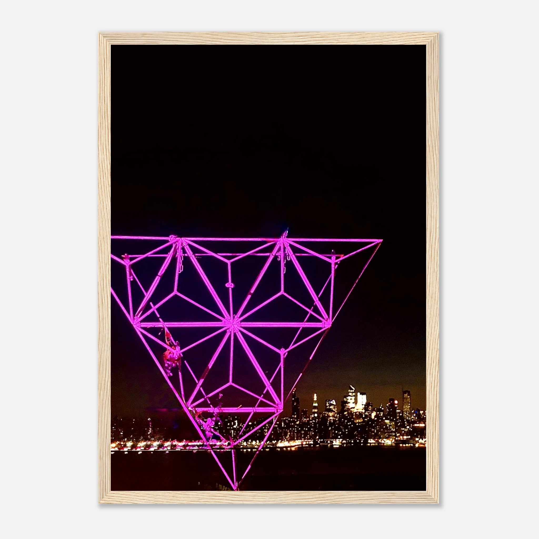 Framed print of New York City holiday art installation featuring Manhattan night view with Empire State Building in purple hues.