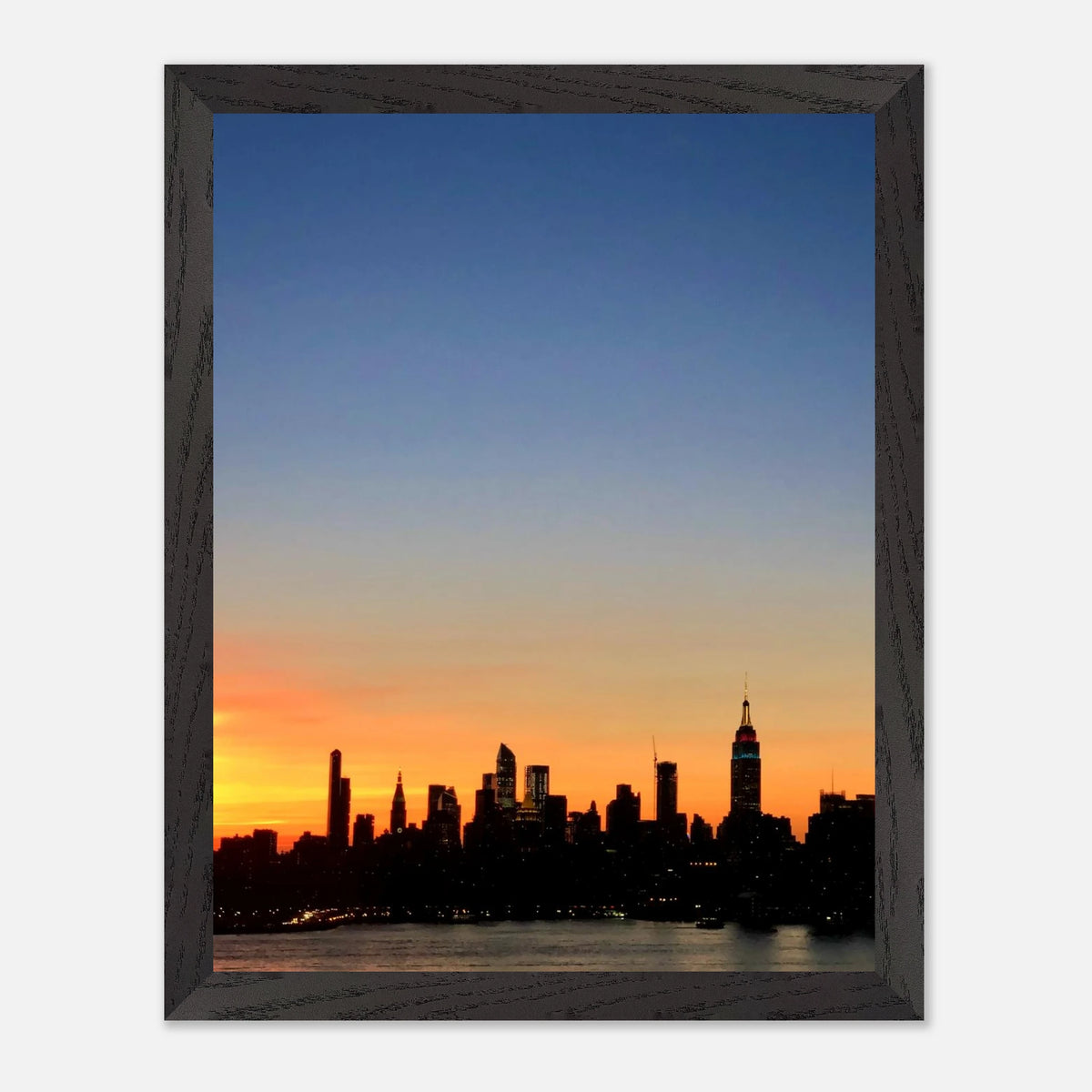 Manhattan skyline sunset framed poster featuring NYC cityscape wall art with vibrant colors and modern print material from My Store.