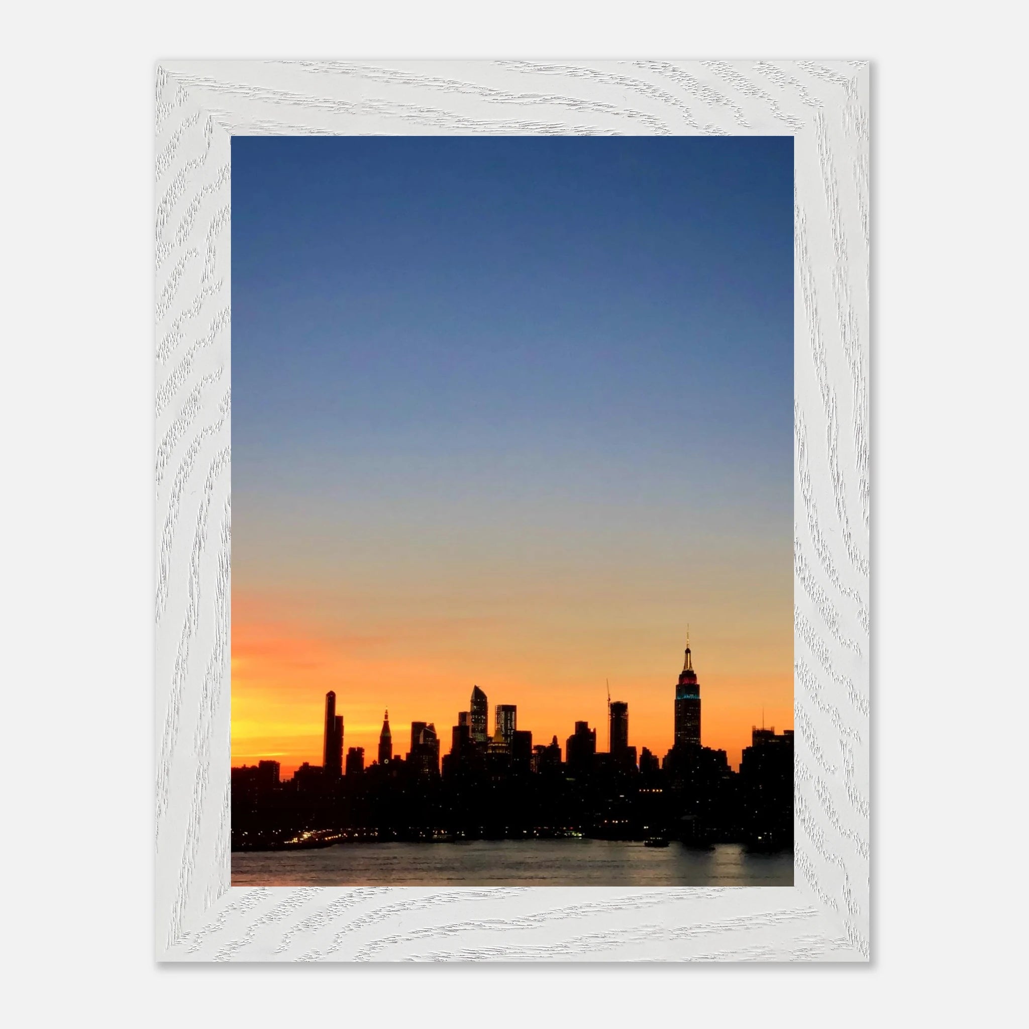Wooden framed Manhattan skyline sunset poster featuring vibrant cityscape, ideal for stylish travel-inspired home decor.