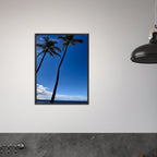 Framed print of Hawaii iconic palm tree twins and Pacific waves, travel collection studio edition by CaliCuration, mounted on wall.
