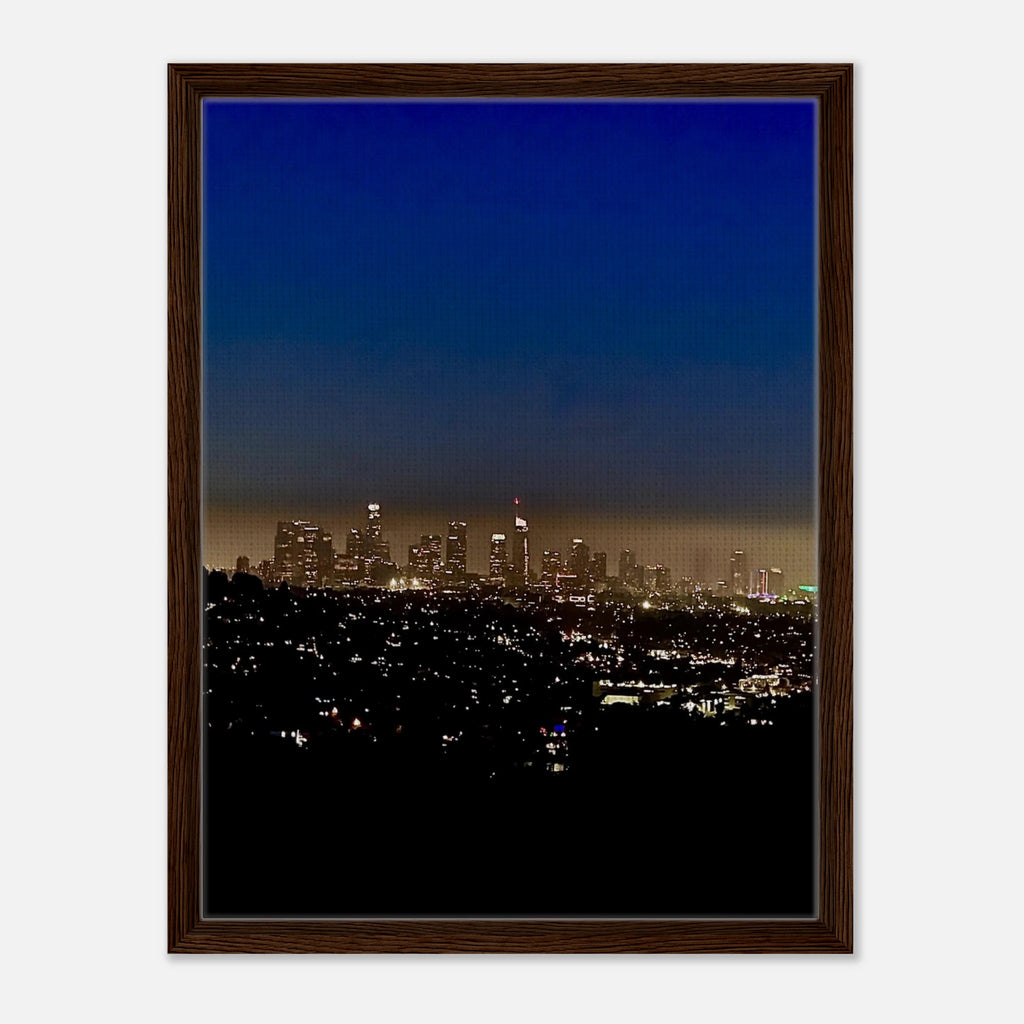 Elegant wooden framed canvas print of Los Angeles Downtown Nightglow, showcasing vibrant city lights and skyline in a studio edition.
