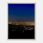 Premium wooden framed canvas print of Los Angeles Downtown Nightglow, featuring vibrant city lights and artistic studio edition design.