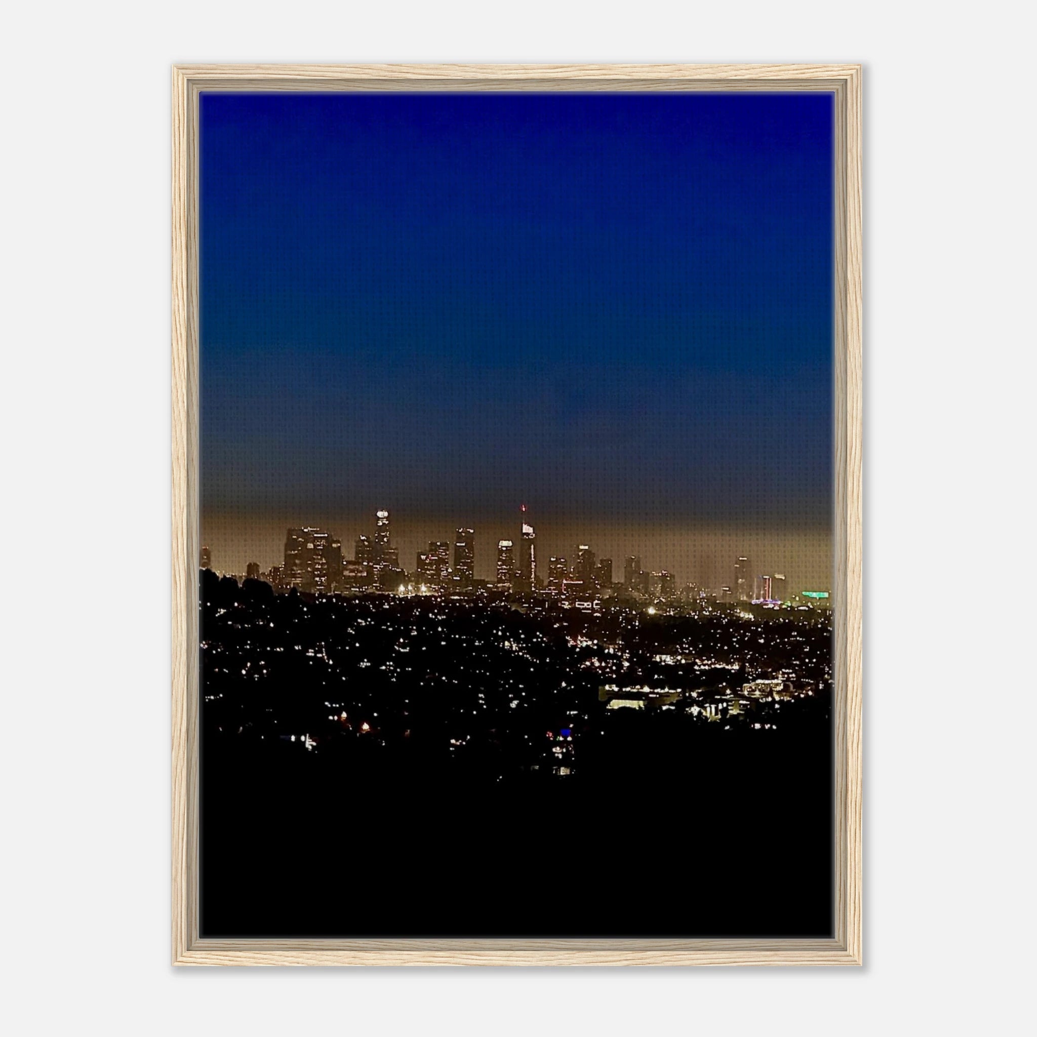 Premium wooden framed canvas print of Los Angeles Downtown Nightglow, featuring vibrant city lights and artistic studio edition design.
