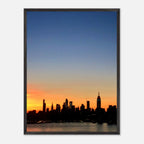Manhattan Skyline sunset framed poster, NYC wall art print on high-quality material with vibrant cityscape details.