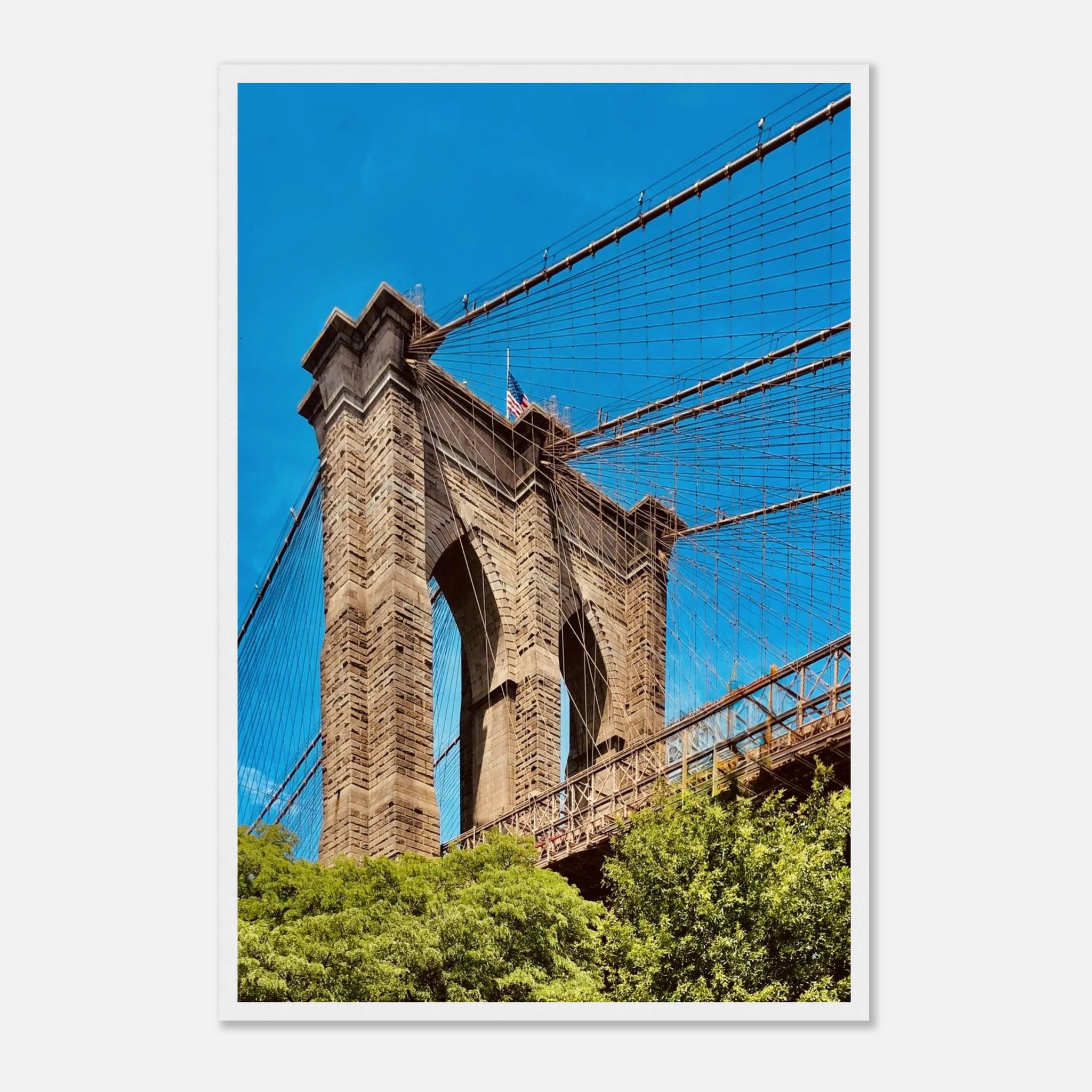 Framed NYC Brooklyn Bridge poster featuring a Dumbo view, showcasing the iconic bridge and city skyline in vibrant print material.