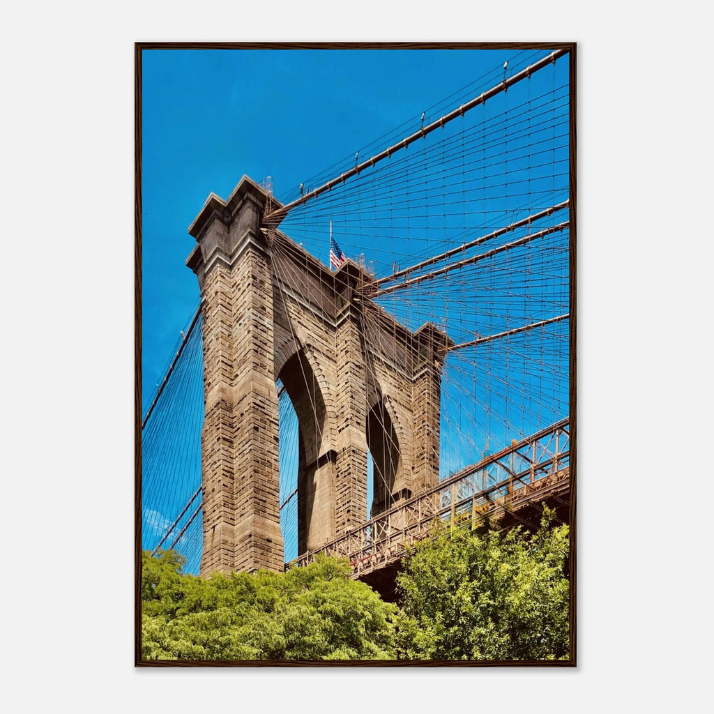 Framed NYC Brooklyn Bridge poster featuring a Dumbo cityscape view, showcasing iconic New York City architecture and skyline.