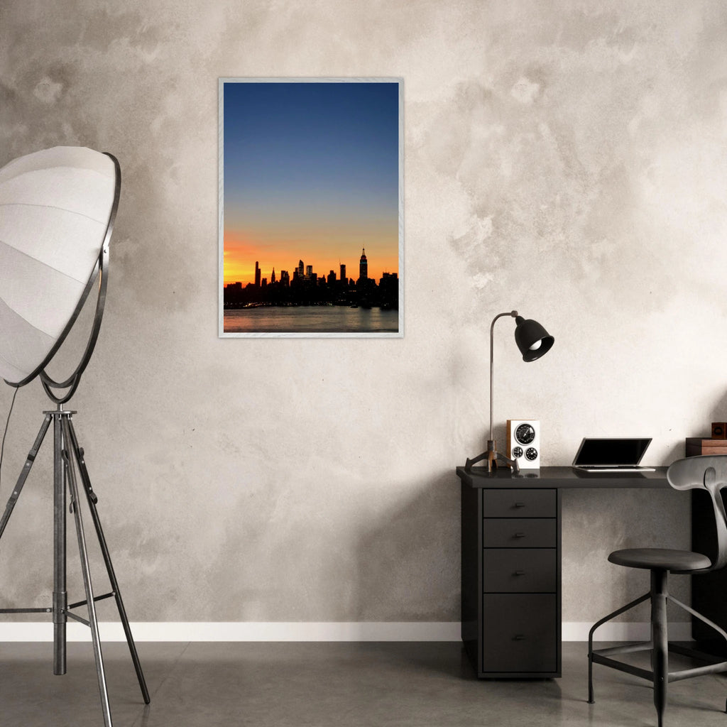 Premium wooden framed poster of Manhattan skyline sunset print, featuring majestic cityscape wall art for home décor.