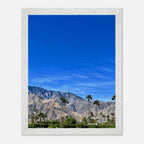 Premium wooden framed poster of a sunny fall day in Palm Springs, California, showcasing vibrant autumn scenery and desert landscape.