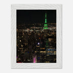 Wood-mounted framed print of NYC downtown night view with Empire State Building, part of the Travel Collection Studio Edition.