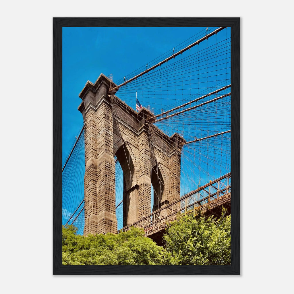 Framed NYC Brooklyn Bridge poster featuring Dumbo view, showcasing iconic New York City skyline in vibrant print material.