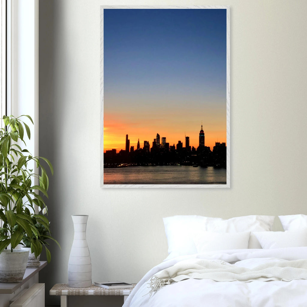 Manhattan Skyline sunset framed poster, NYC wall art print on high-quality material, featuring vibrant cityscape colors.