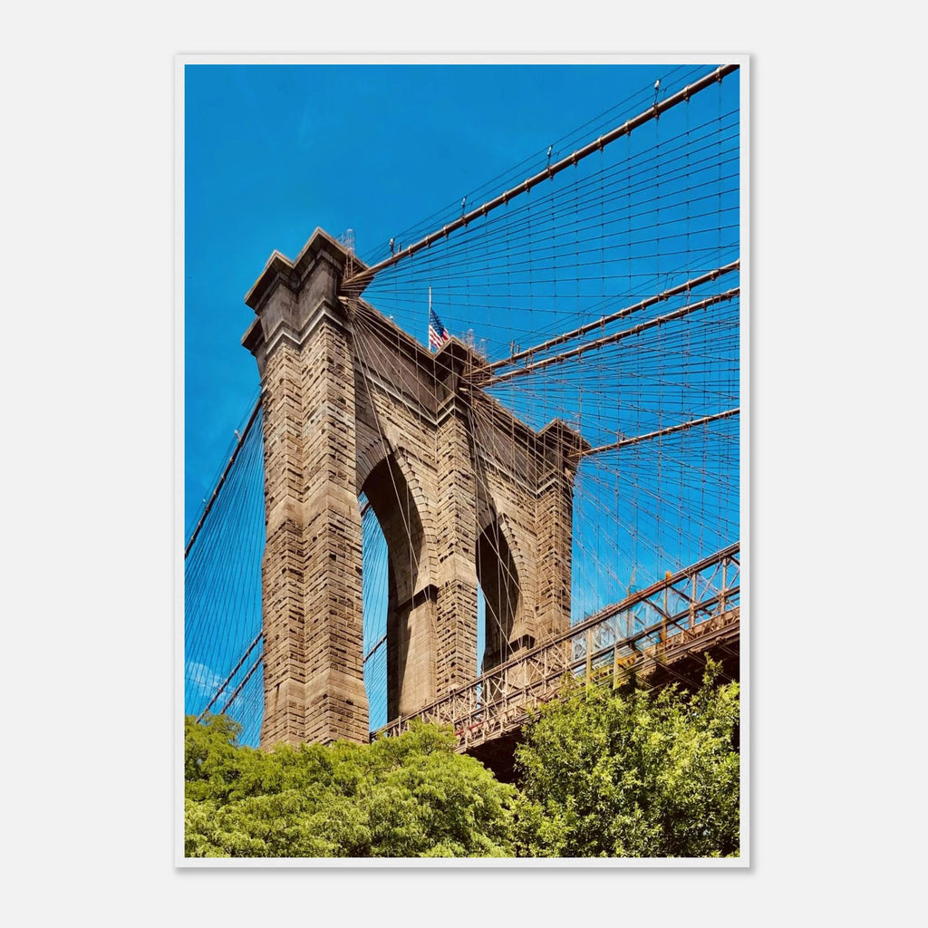 Framed NYC Brooklyn Bridge print featuring a Dumbo view, showcasing iconic New York City skyline and the bridge at sunset.