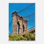 Framed NYC Brooklyn Bridge print featuring a Dumbo view, showcasing iconic New York City skyline and the bridge at sunset.