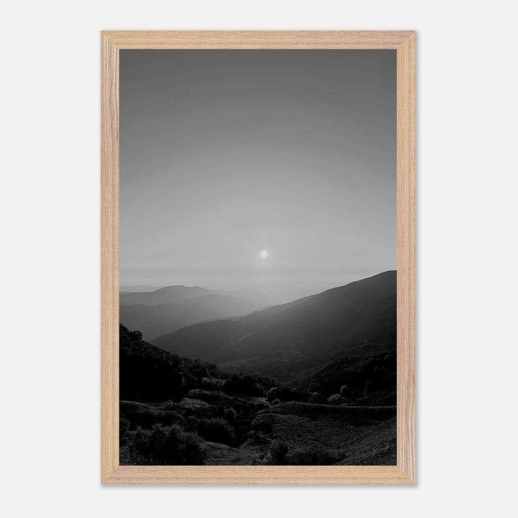 Black and white framed poster of California Central Coast sunset from the Studio Edition travel collection, mounted on a wall.