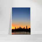 Manhattan Skyline sunset framed poster featuring NYC wall art on high-quality print material, showcasing a vibrant cityscape.