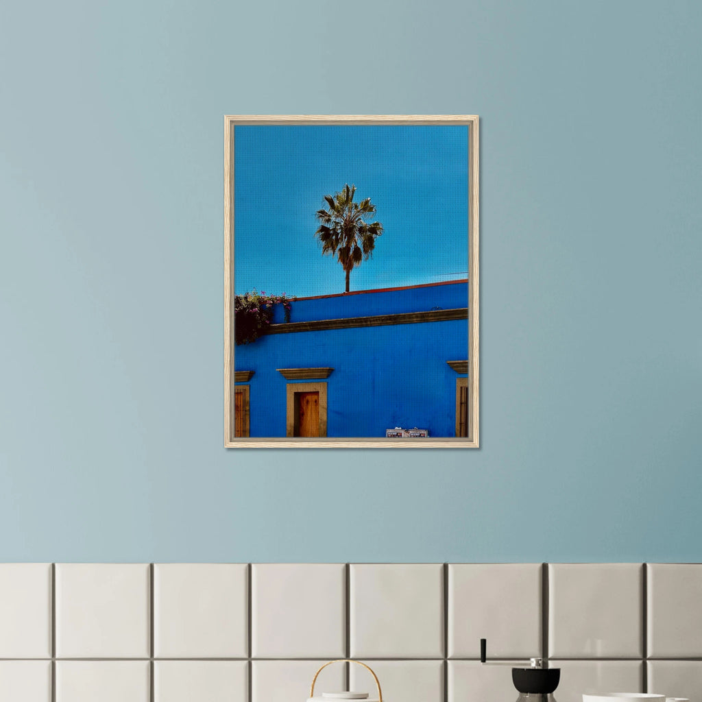 Oaxaca streets with palm trees in blue framed canvas print by CaliCuration, vibrant travel artwork from the Spring 26 collection.