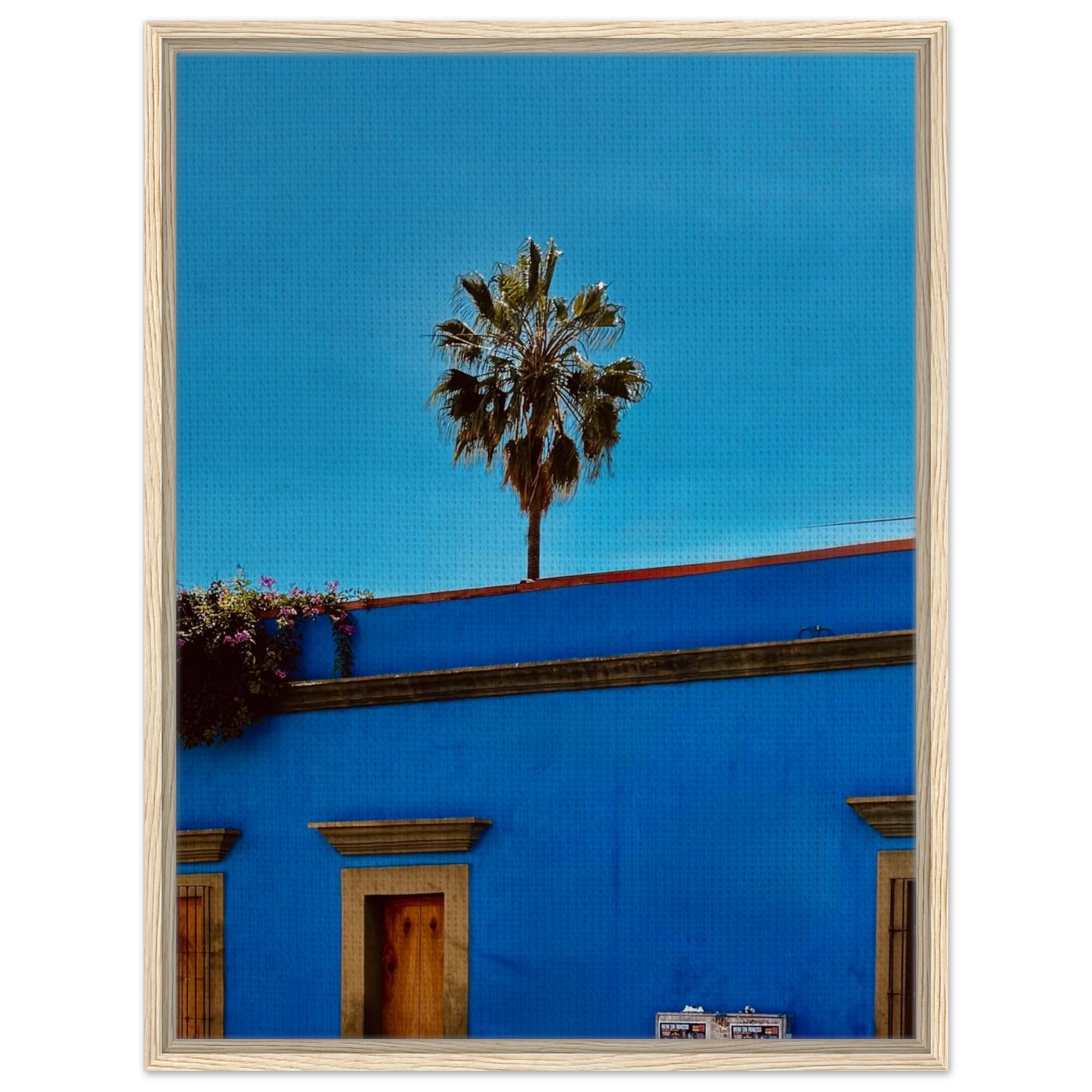 Oaxaca streets with palm trees in vibrant colors displayed on a blue framed canvas print by CaliCuration, part of the Mexico travel collection.