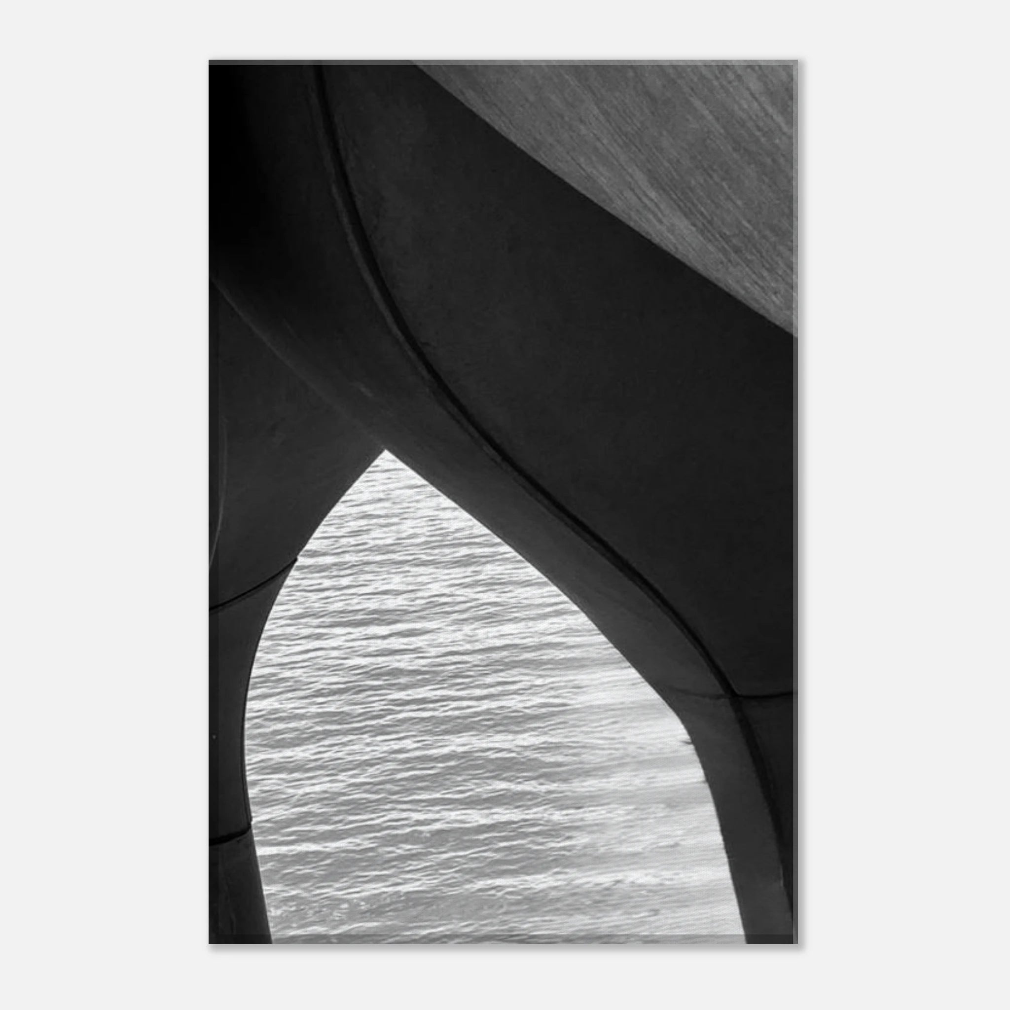 Black and white abstract canvas print of NYC Hudson River pier with high heels in water, from the Studio Edition Travel Collection.