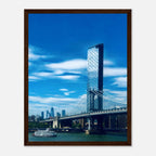 Framed NYC wall art print featuring the Manhattan Bridge and East River, showcasing detailed cityscape and urban scenery.